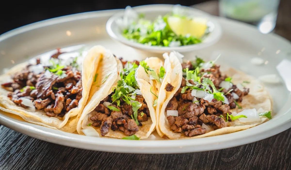Grilled street tacos on corn tortillas with onions, cilantro and fresh salsa at Cabos Mexican Restaurant