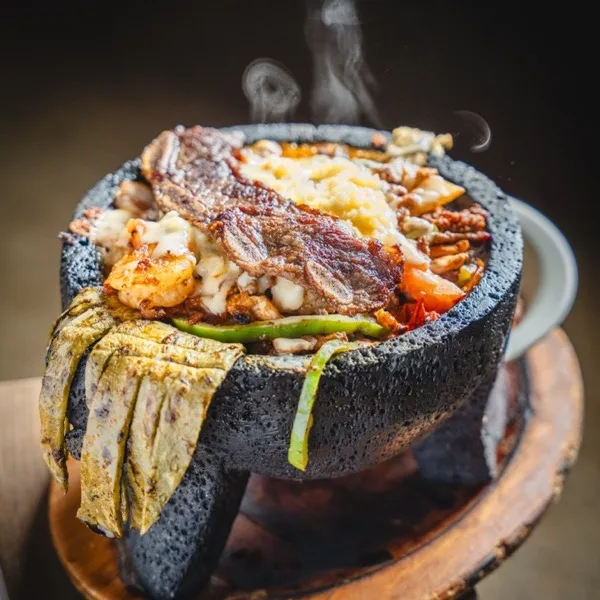 Molcajete especial at Cabos with steak, chicken and shrimp over cactus